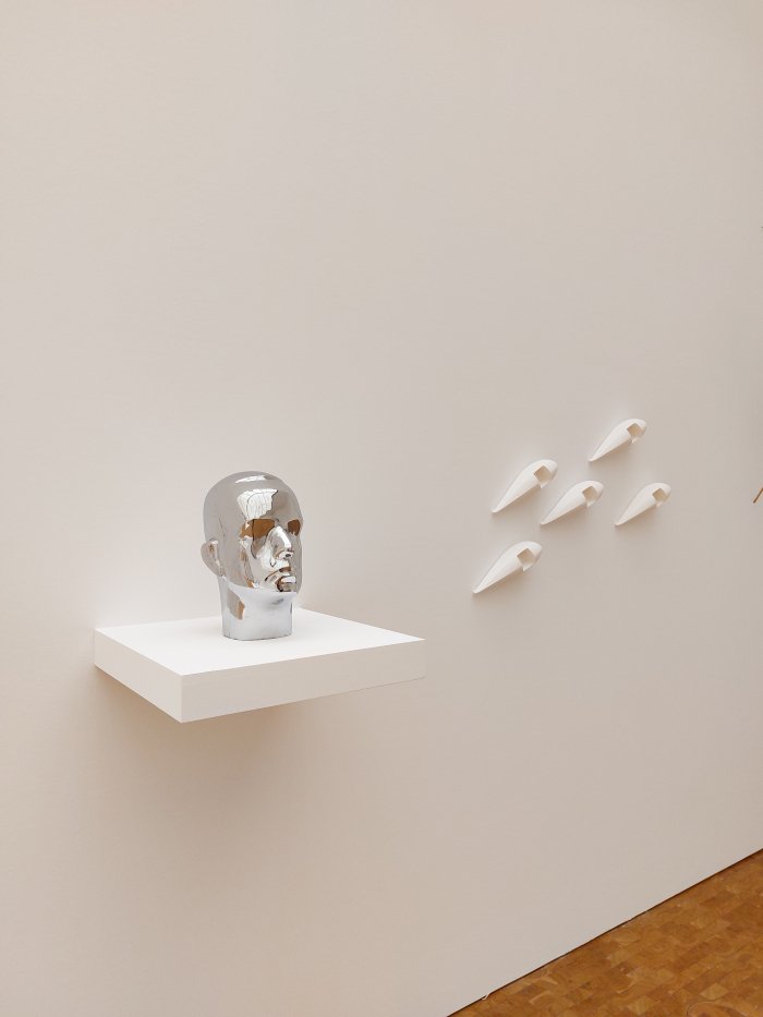 A Richard Buckminster Fuller bust and designs for the Dymaxion Car, by Isamu Noguchi, as seen at Isamu Noguchi, Museum Ludwig, Cologne