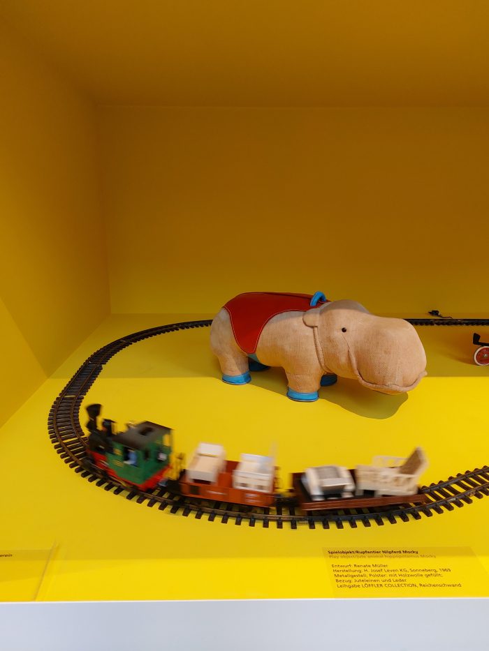 Express delivery for Mocky!!! Renate Müller's hippo Mocky, and a toy train, as part of a display of upholstered objects for children, as seen at Deep-seated. The Secret Art of Upholstery, Grassi Museum für Angewandte Kunst, Leipzig